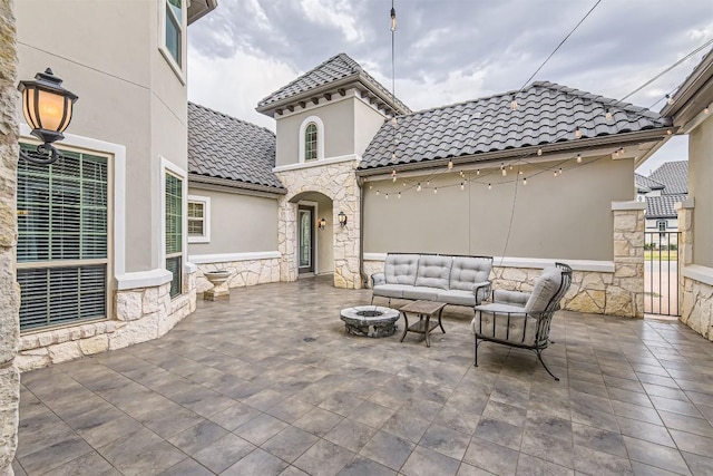 921 Morning Moon Cir, Austin, TX 78732 - view of patio / terrace featuring an outdoor living space with a fire pit