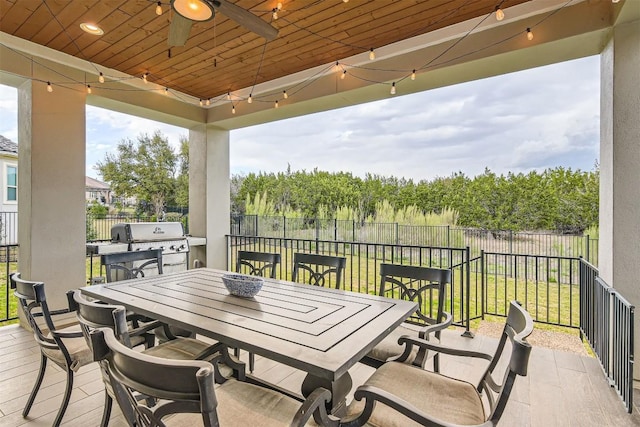 921 Morning Moon Cir, Austin, TX 78732 - fenced backyard featuring a grill, ceiling fan, and outdoor dining space