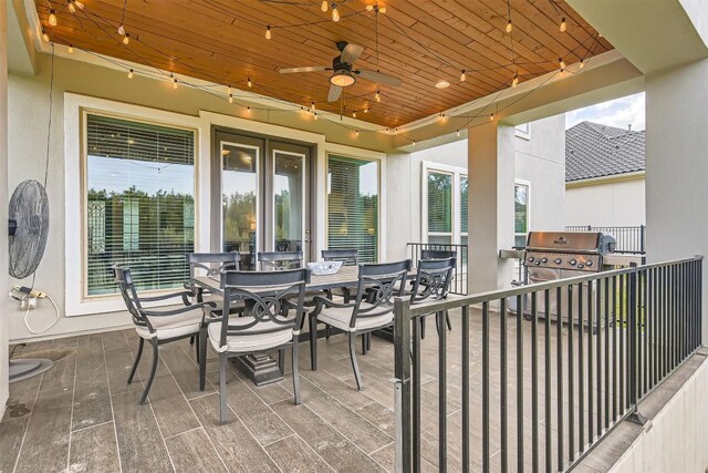 921 Morning Moon Cir, Austin, TX 78732 - view of patio / terrace featuring exterior kitchen, outdoor dining space, and a ceiling fan