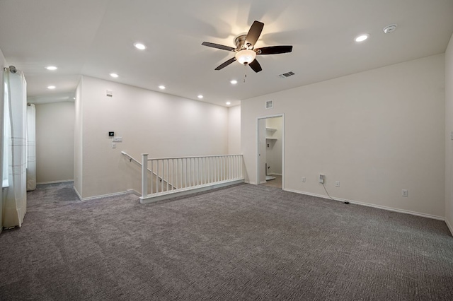 carpeted spare room featuring recessed lighting, a ceiling fan, visible vents, and baseboards