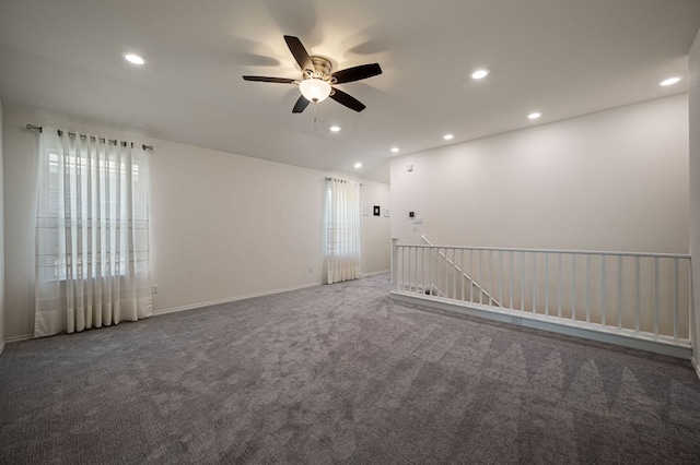 carpeted empty room featuring recessed lighting, a ceiling fan, and baseboards