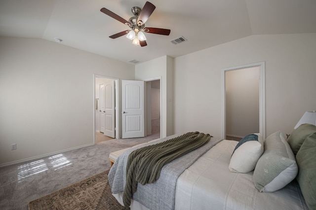 bedroom featuring vaulted ceiling, baseboards, visible vents, and carpet floors