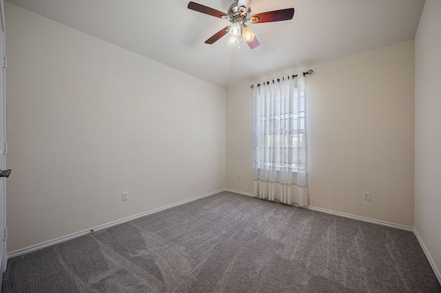 unfurnished room featuring carpet flooring, baseboards, lofted ceiling, and ceiling fan