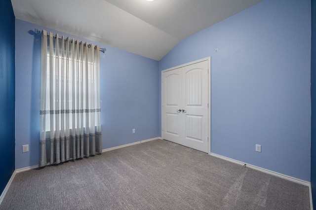 404 Buttercup Creek Blvd Unit 10, Cedar Park, TX 78613 - unfurnished bedroom featuring vaulted ceiling, carpet floors, baseboards, and a closet