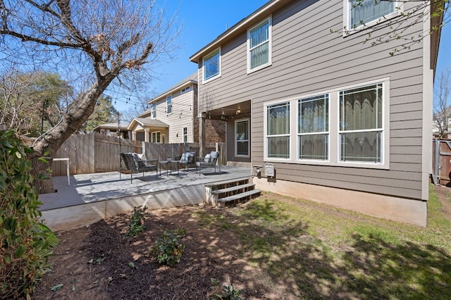 back of property with a patio and fence