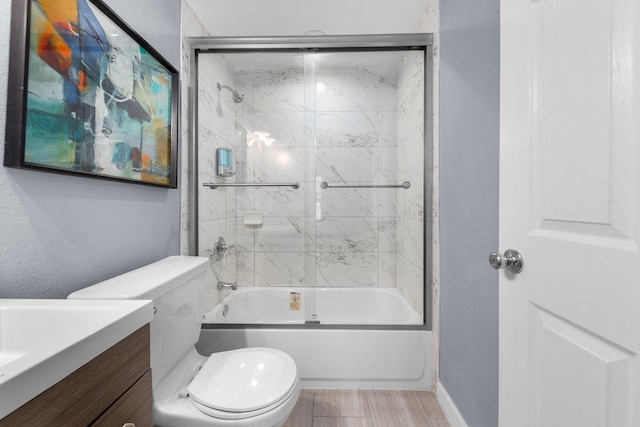 full bathroom featuring enclosed tub / shower combo, toilet, vanity, and wood finished floors