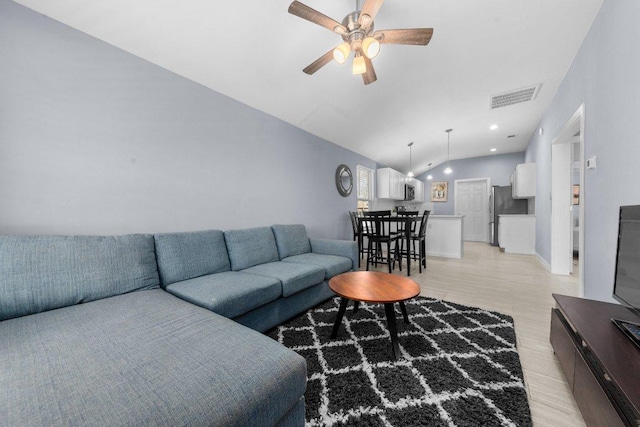 living room featuring visible vents, light wood finished floors, recessed lighting, ceiling fan, and vaulted ceiling