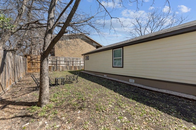 view of yard with a fenced backyard