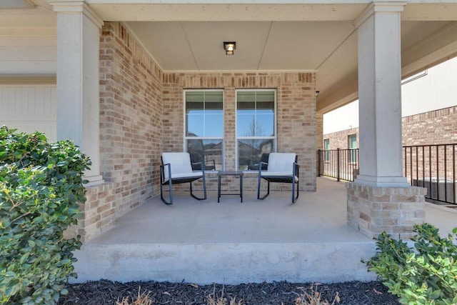 view of patio featuring a porch