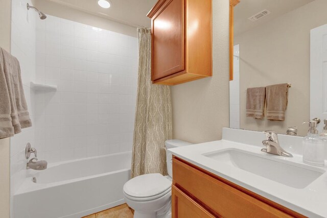 full bathroom featuring visible vents, shower / bathtub combination with curtain, toilet, and vanity