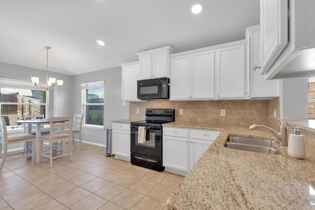 kitchen featuring white cabinetry, black appliances, tasteful backsplash, and a sink