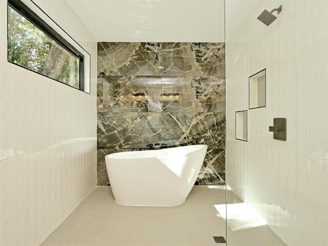 5010 Rowena Ave Unit 1, Austin, TX 78751 - bathroom with tile walls, a freestanding bath, and a tile shower