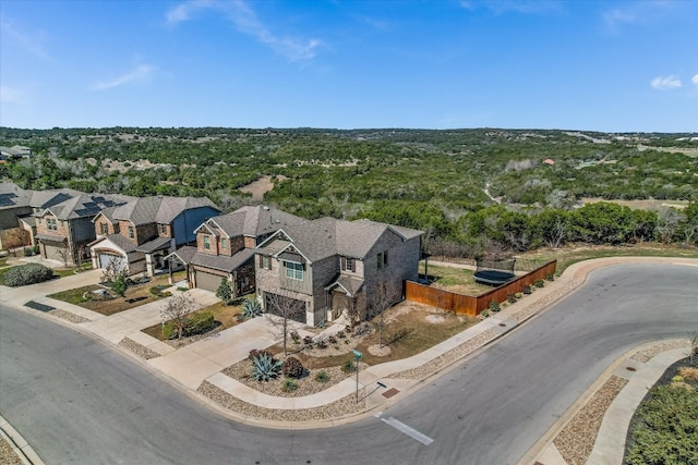 birds eye view of property with a residential view