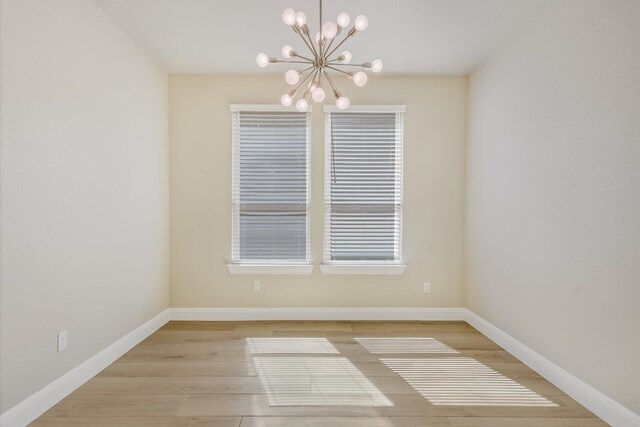 5300 Traviston Dr, Austin, TX 78738 - unfurnished room with a chandelier and wood finished floors