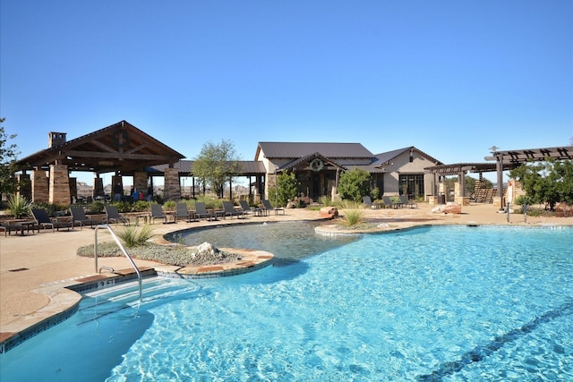 pool featuring a patio and a pergola