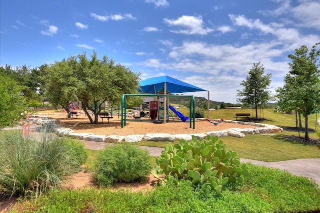 community play area featuring a lawn