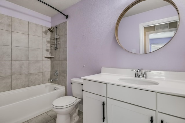 full bathroom featuring visible vents, toilet,  shower combination, tile patterned flooring, and vanity