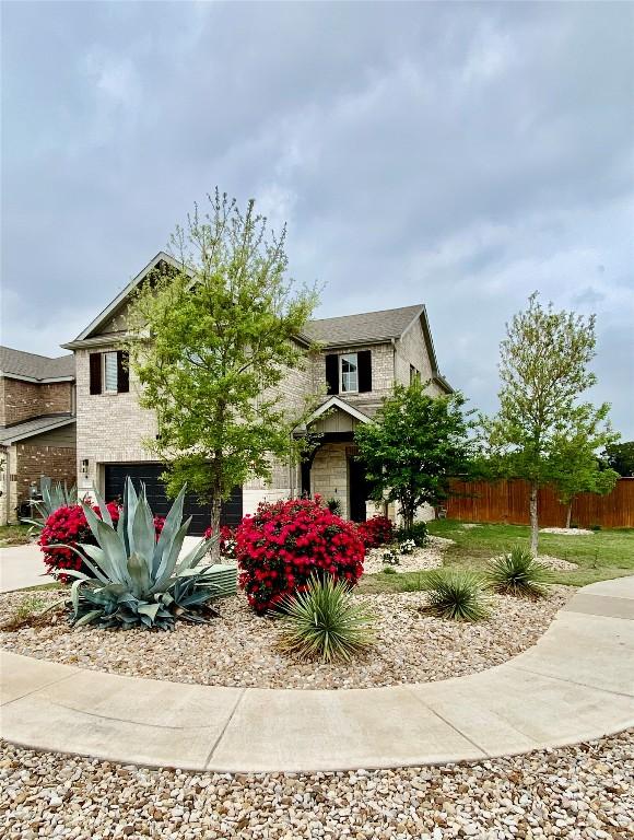 5300 Traviston Dr, Austin, TX 78738 - view of property hidden behind natural elements featuring a garage