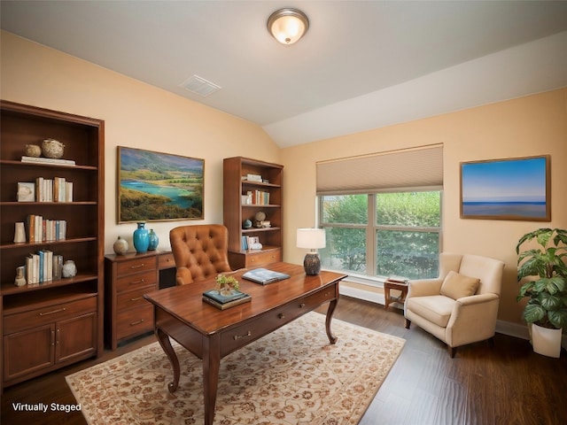 office space featuring dark wood finished floors, visible vents, baseboards, and vaulted ceiling