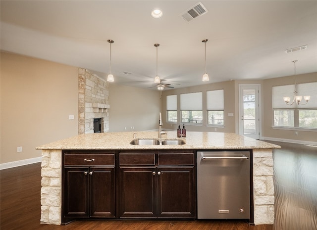 kitchen featuring dishwasher, open floor plan, visible vents, and a sink