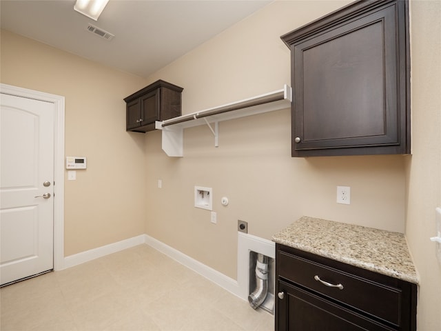 clothes washing area featuring hookup for a washing machine, baseboards, visible vents, cabinet space, and electric dryer hookup