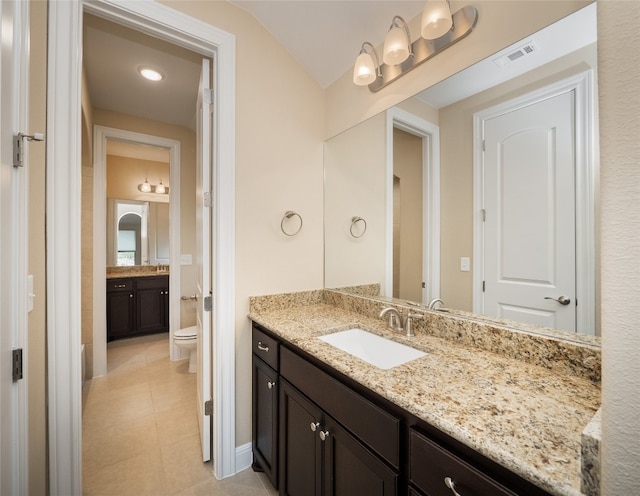 full bathroom featuring tile patterned floors, visible vents, toilet, and vanity