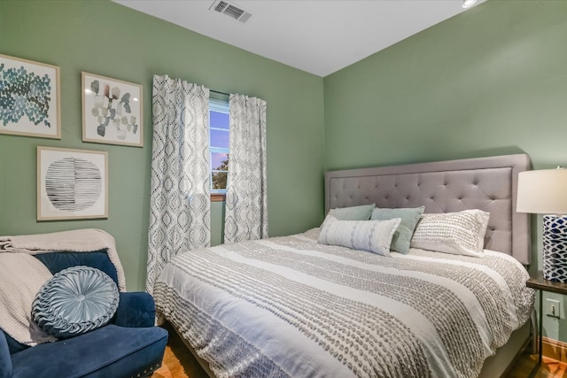 bedroom featuring visible vents