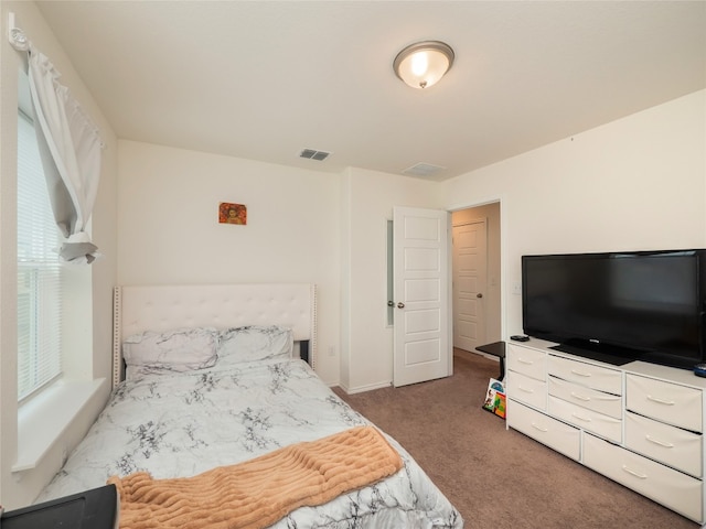 bedroom with visible vents and carpet floors