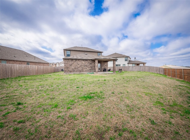 view of yard with a patio and a fenced backyard