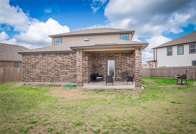 201 Teller Dr, Lockhart, TX 78644 - rear view of property with a patio area and brick siding
