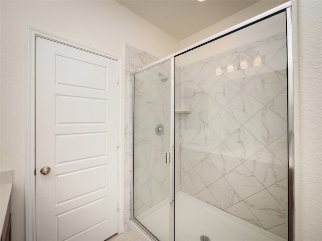 bathroom with a shower stall