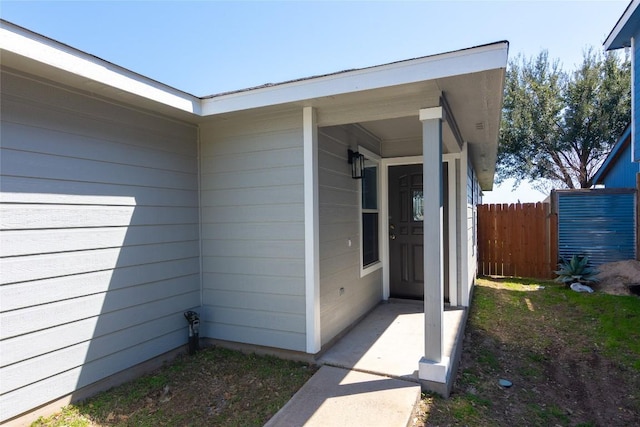 doorway to property with fence