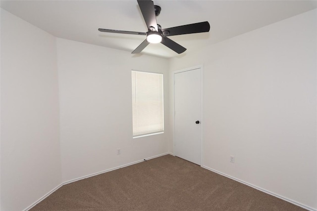 unfurnished room featuring carpet and a ceiling fan