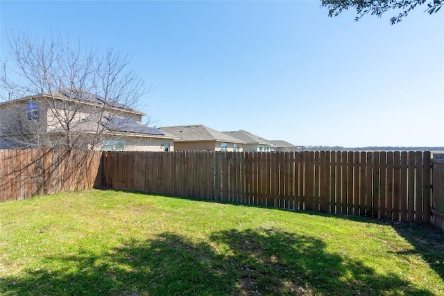 view of yard with a fenced backyard