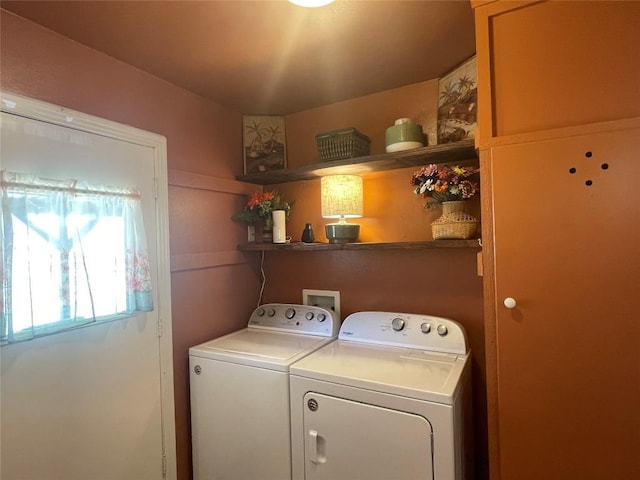 laundry area with laundry area and separate washer and dryer