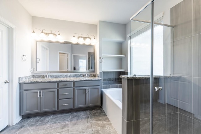 bathroom featuring double vanity, an enclosed shower, a bath, and a sink