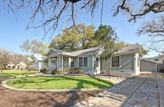 view of front of house with an outbuilding, driveway, a front lawn, a garage, and crawl space