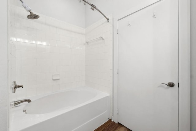 bathroom featuring shower / bath combination and wood finished floors