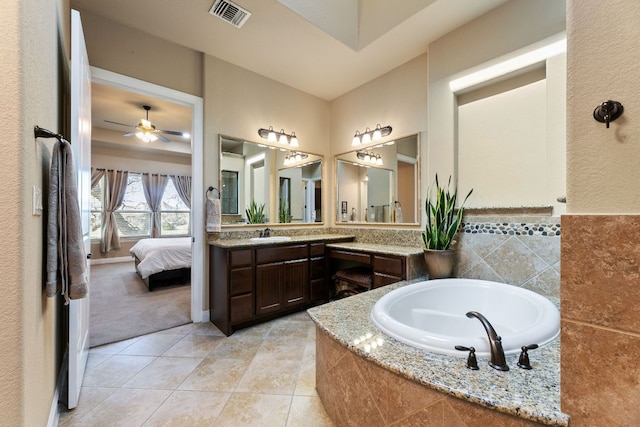 ensuite bathroom with visible vents, a bath, ensuite bathroom, tile patterned floors, and vanity