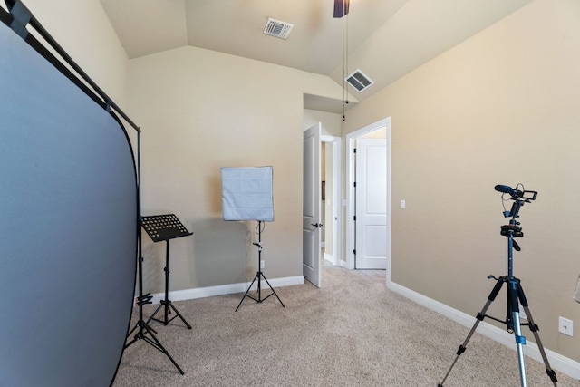 miscellaneous room featuring visible vents, carpet, and lofted ceiling