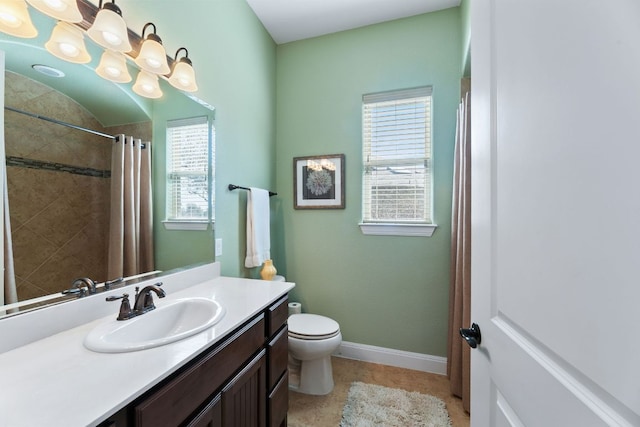 full bathroom with vanity, toilet, a shower with curtain, and baseboards