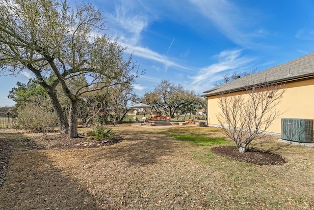 view of yard with central AC