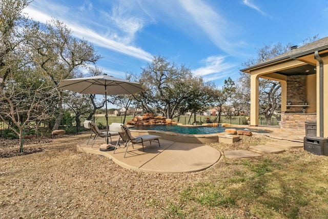 exterior space featuring a patio, area for grilling, and a fenced in pool