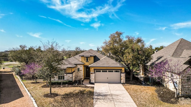 view of front facade with stone siding, concrete driveway, a garage, and a shingled roof