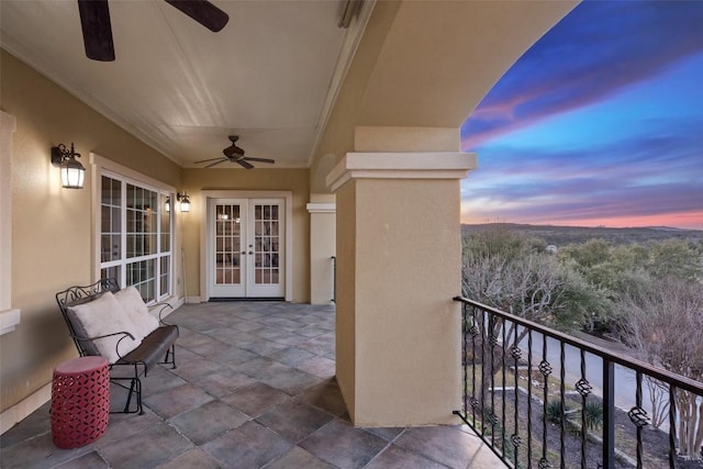 balcony with french doors and ceiling fan