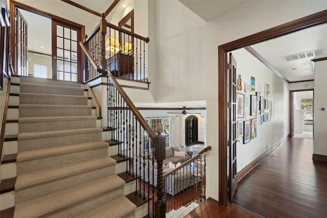 12027 Pleasant Panorama Vw, Austin, TX 78738 - staircase with wood finished floors, ornamental molding, and ceiling fan