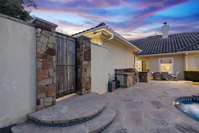 12027 Pleasant Panorama Vw, Austin, TX 78738 - view of patio / terrace with an outdoor kitchen