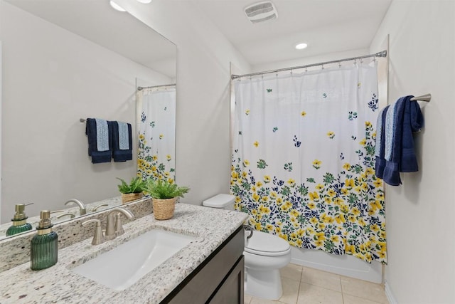 bathroom featuring visible vents, toilet, shower / tub combo with curtain, tile patterned floors, and vanity