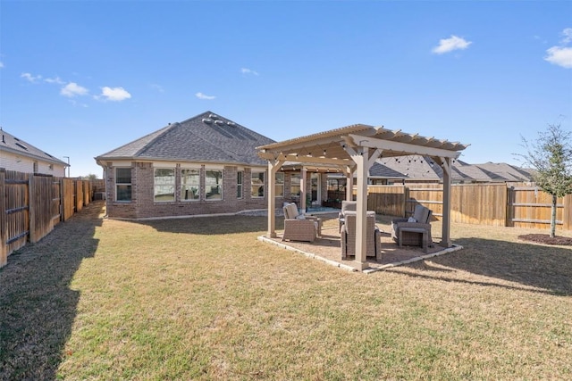 rear view of property with a pergola, a fenced backyard, a yard, brick siding, and a patio area