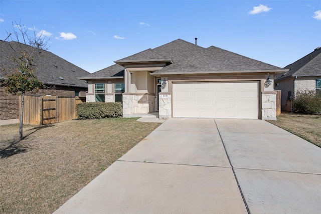 view of front of home featuring stucco siding, fence, roof with shingles, concrete driveway, and a garage